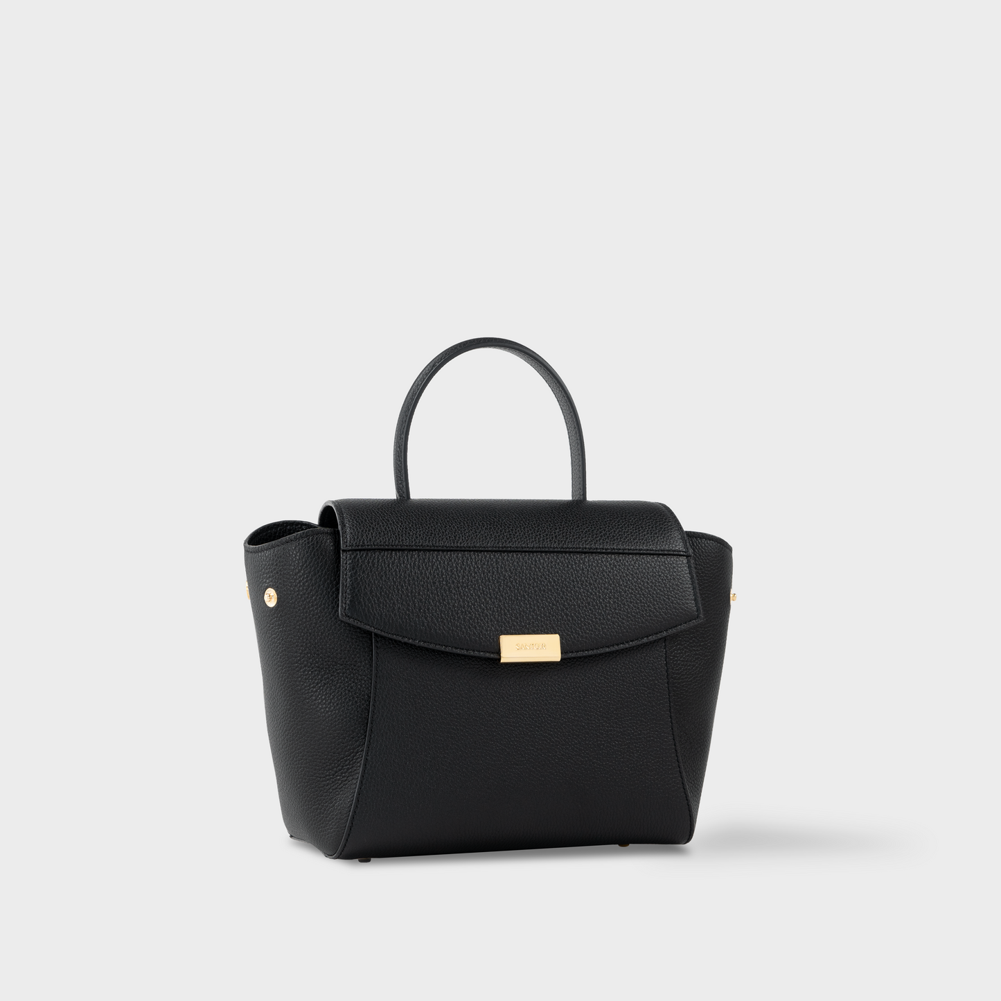 Side profile of Santoir Mini Boss bag in black grained calfskin, structured mini handbag with sculptural silhouette and pebbled texture, made in Spain.