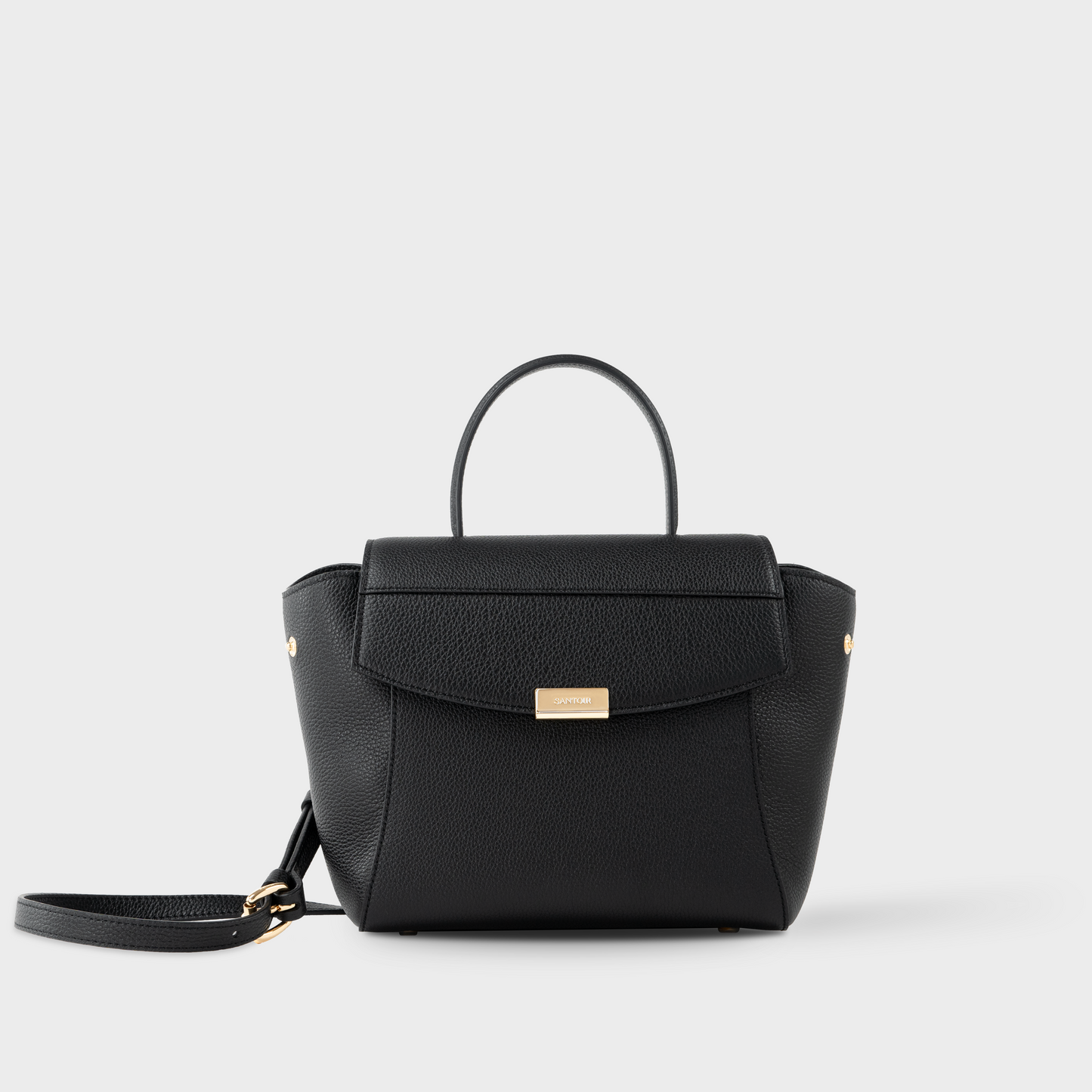 Black leather mini top handle bag in pebbled calfskin, Santoir Mini Boss with structured silhouette, minimalist design and gold-tone hardware, handcrafted in Spain.