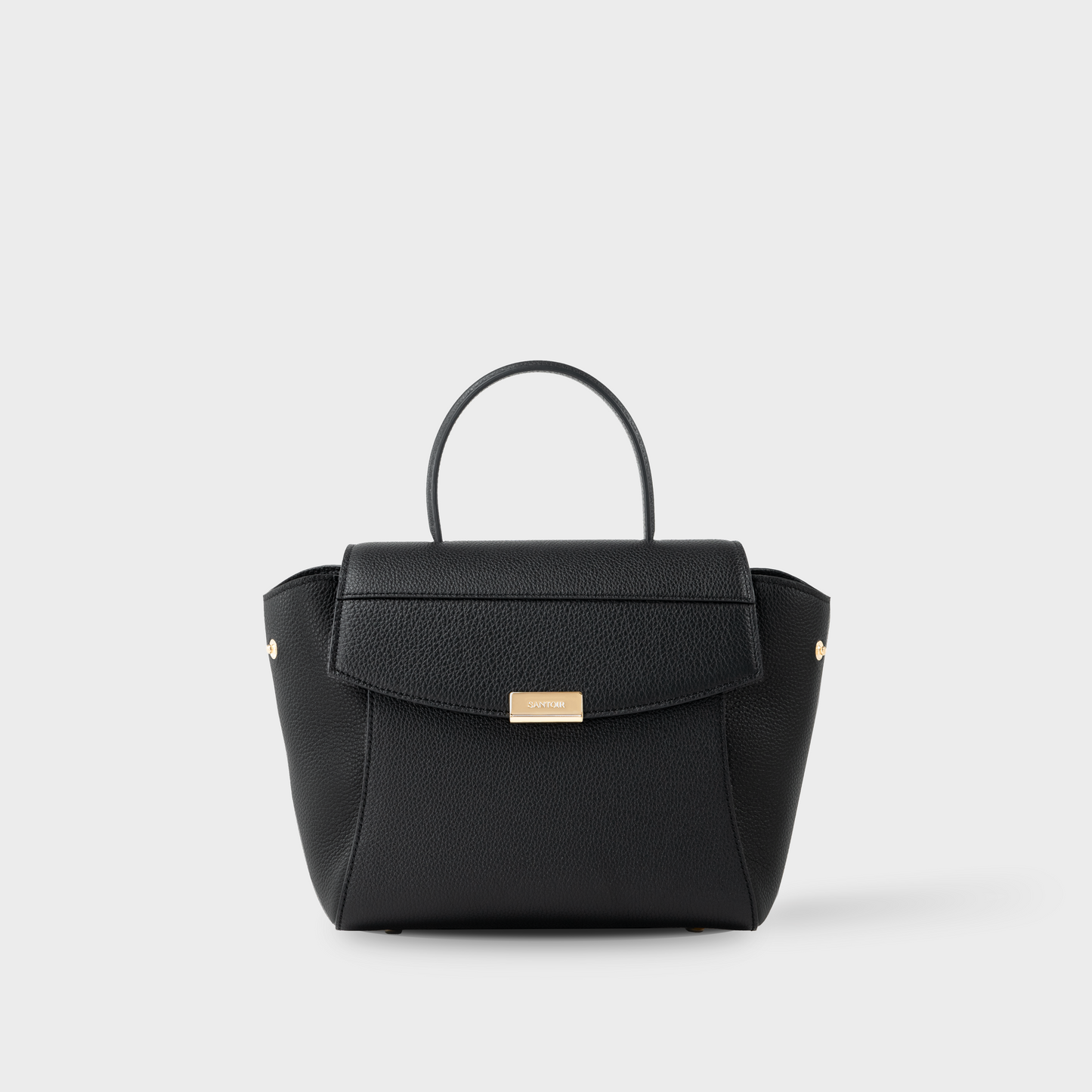 A black leather handbag with solid brass hardware featuring an 18k gold finish.