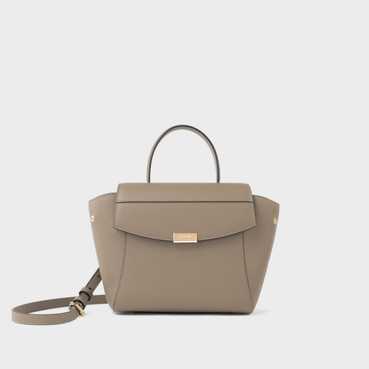 Taupe leather mini top handle bag in pebbled calfskin, Santoir Mini Boss with structured silhouette, greige neutral tone, minimalist design and gold-tone hardware, handcrafted in Spain.