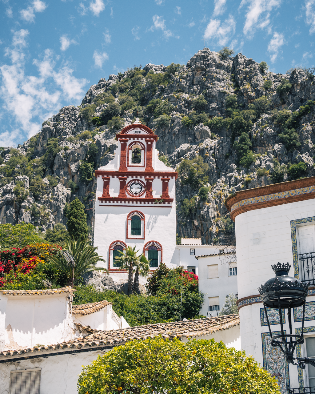 Ubrique Church Bell Tower with mountains behind